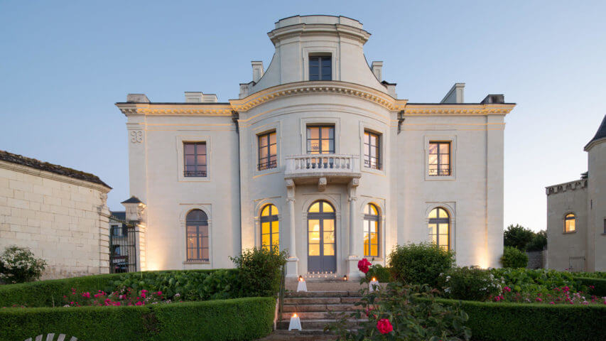 Chateau in Loire front with garden and red roses